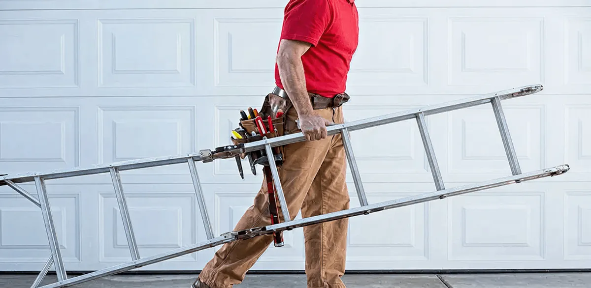 Garage door repair technician arriving with tools and ladder in Yonkers, NY
